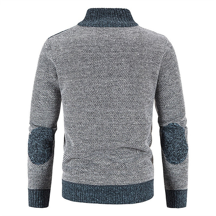 Comfortabel gebreid herenvest met rits en patchwork; warm en modieus voor koude dagen.