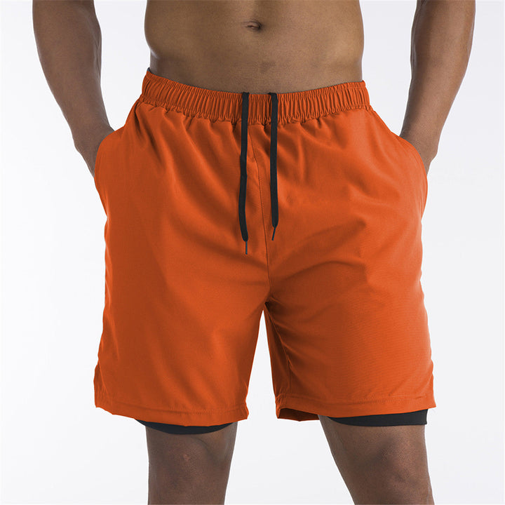 Ondersteunende heren sportshorts met ingebouwde binnenbroek en praktische telefoonzak voor ononderbroken workouts.