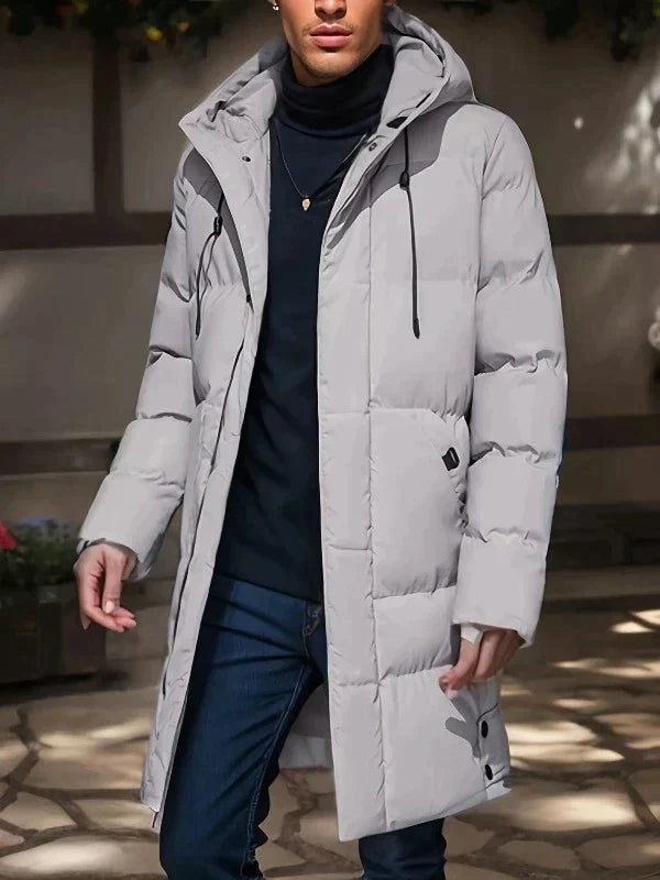 Zwarte heren lange winterjas, dikke pufferjas voor een warme en modieuze winterlook.