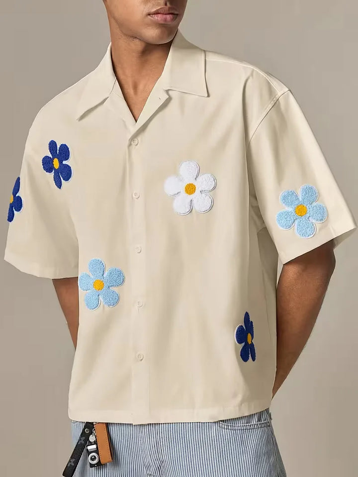 Casual herenoverhemd, korte mouw, met opvallend bloemenmotief, perfect voor de zomer.