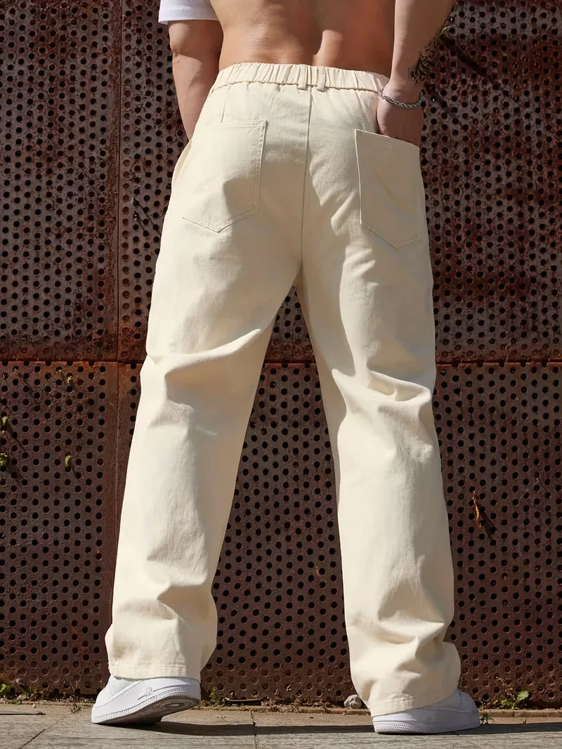 Casual heren pantalon voor lente/zomer, elastische band en wijde pijpen voor comfort.