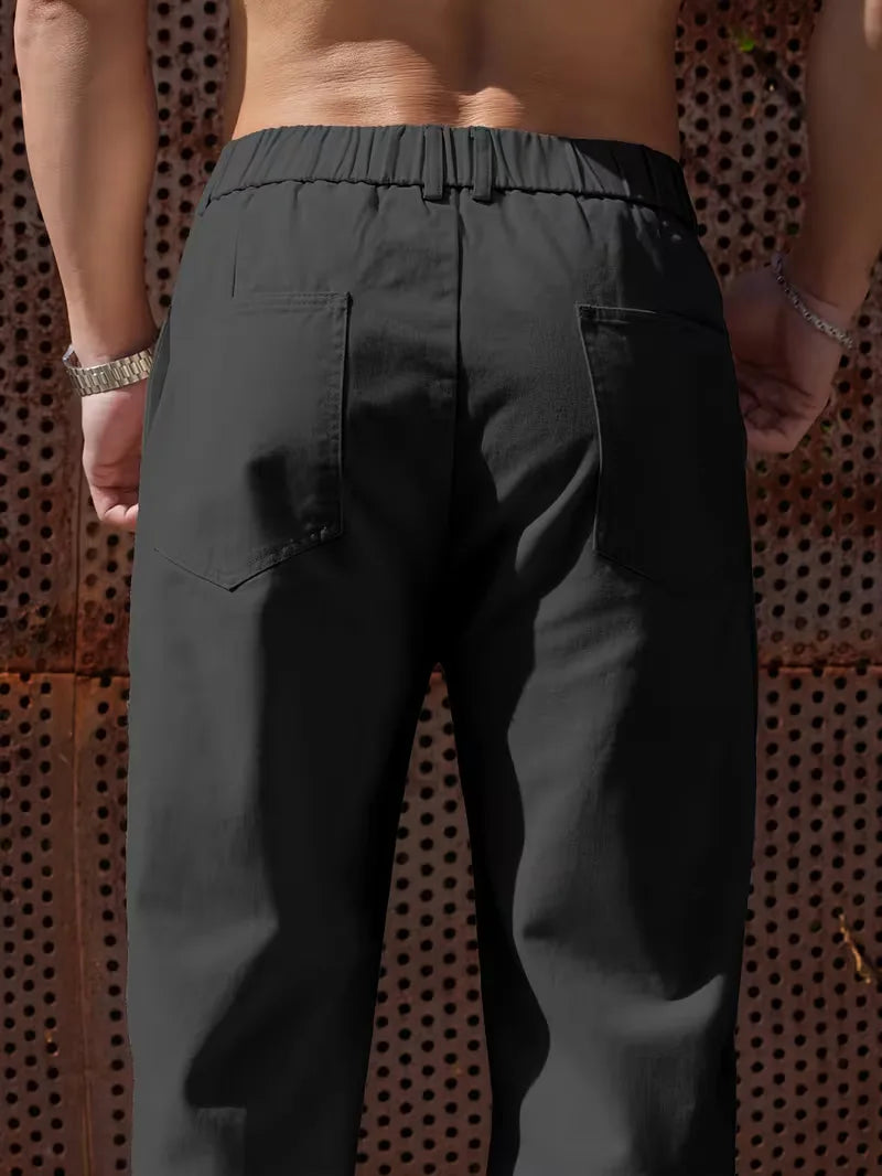 Heren pantalon, wijde pijpen, elastische band, combineert functionaliteit met een moderne uitstraling.