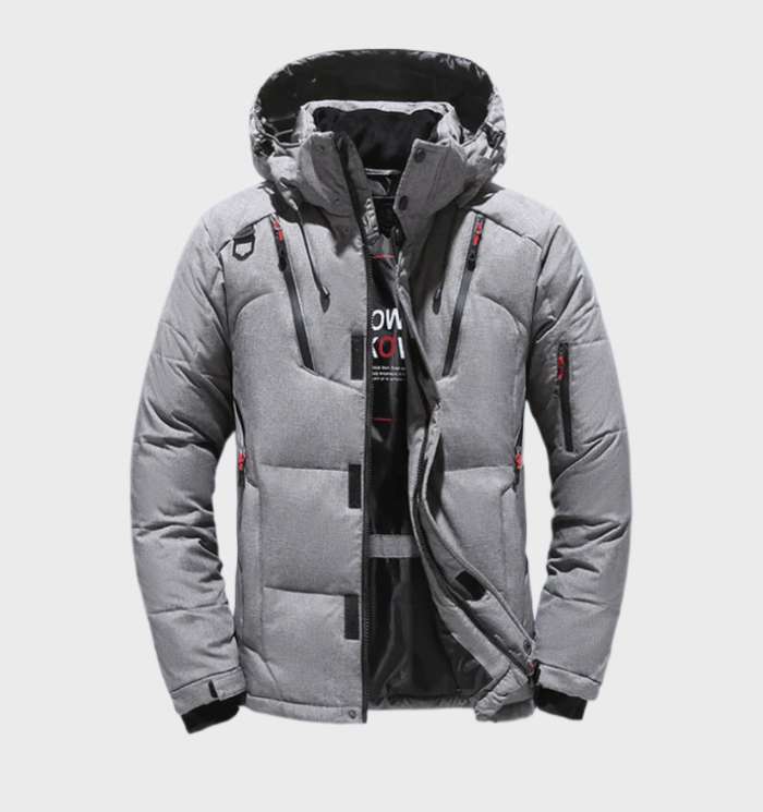 Man draagt moderne herenparka winterjas met capuchon, geschikt voor herfst en winter.