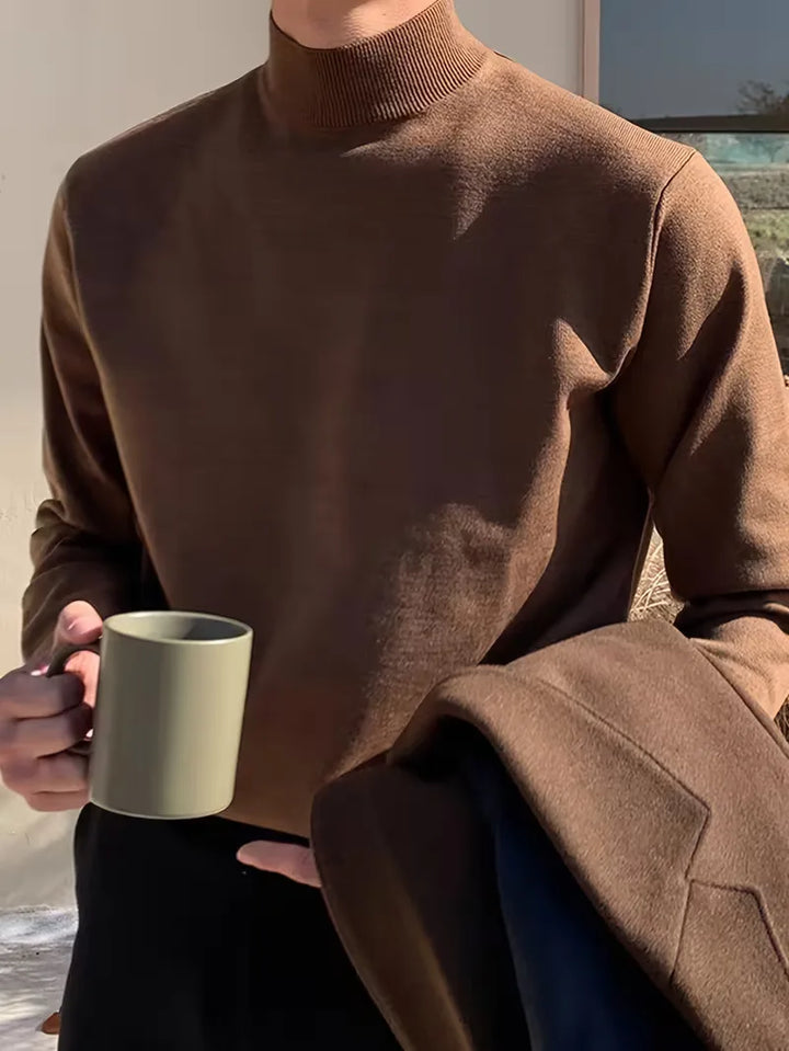 Warme heren trui met hoge rolkraag, ideaal voor koude winterdagen. Stijlvolle en comfortabele herenkleding.
