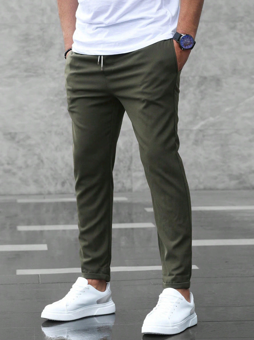 Veelzijdige heren slim fit broek met trekkoord en elastische taille, geschikt voor kantoor en casual gelegenheden.