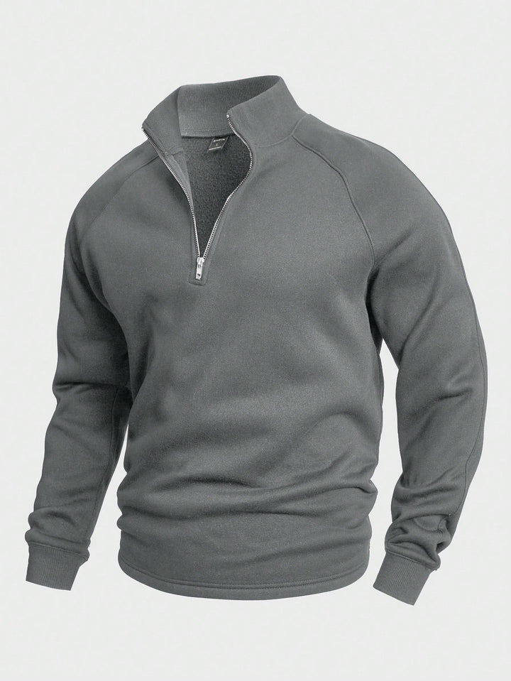 Sportieve heren trui met halve rits. Perfect als winterkleding of voor een gelaagde look, makkelijk te onderhouden.