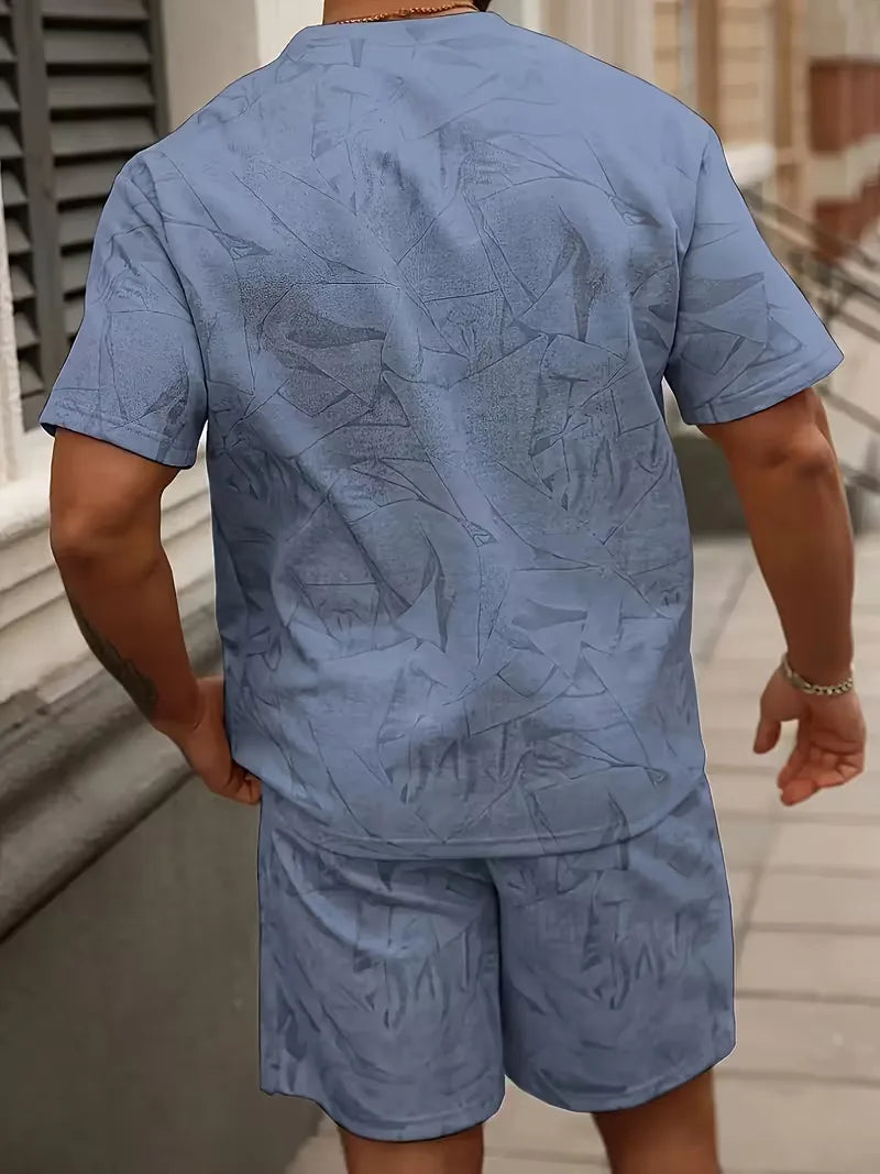Zomerse heren strandkleding set: abstracte print shorts en bijpassend shirt, comfortabel en trendy.