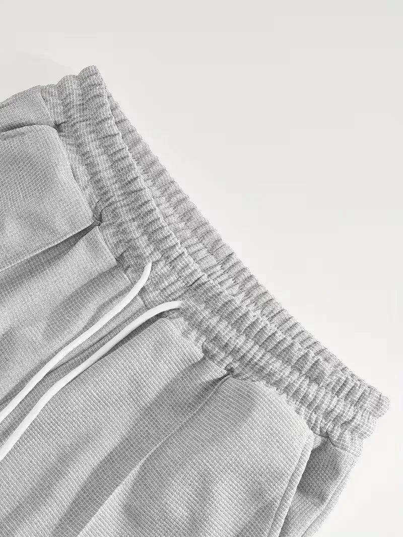 Heren sportieve tweedelige kledingset: T-shirt en shorts voor actieve zomerdagen.