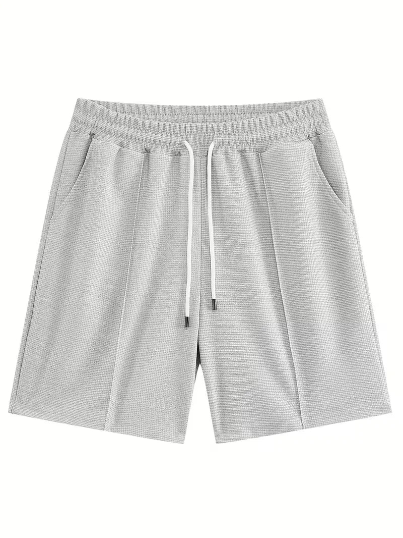Moderne heren zomer set: T-shirt met korte mouwen en shorts, voor een trendy, relaxte look.