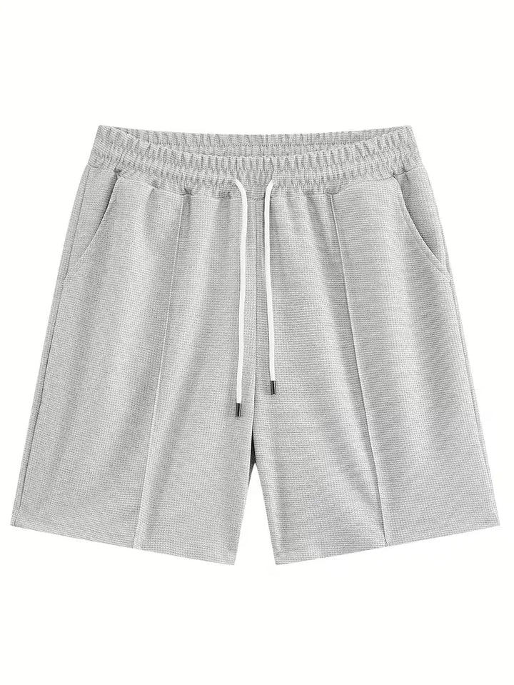 Moderne heren zomer set: T-shirt met korte mouwen en shorts, voor een trendy, relaxte look.