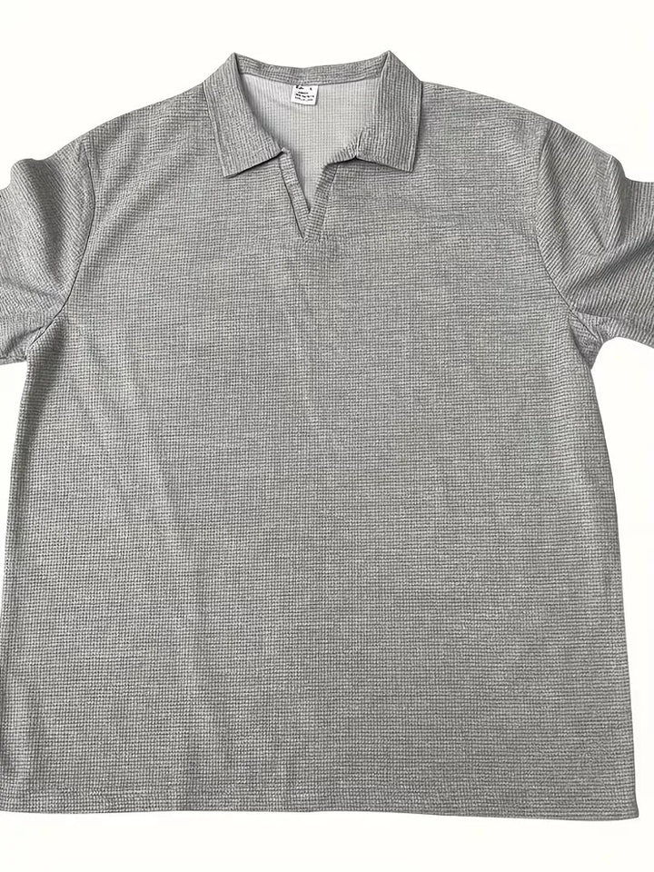 Casual herenpolo met korte mouwen en V-hals, regular fit en fijne textuur.