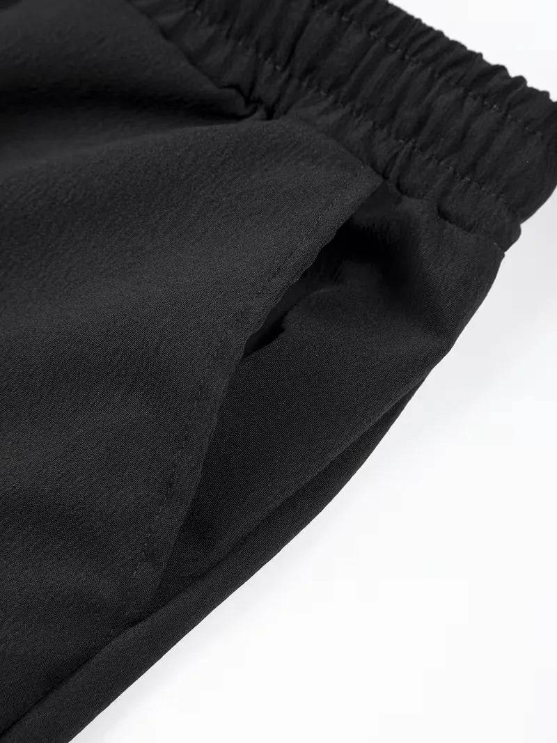 Heren vakantie shorts, geplooid, met elastische taille, perfect voor ontspanning.