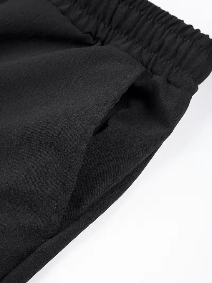 Heren vakantie shorts, geplooid, met elastische taille, perfect voor ontspanning.
