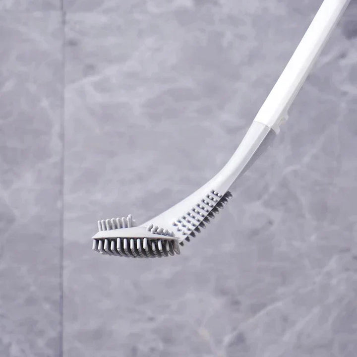 De complete toiletborstelset staand naast een toilet, toont compactheid en functionaliteit.