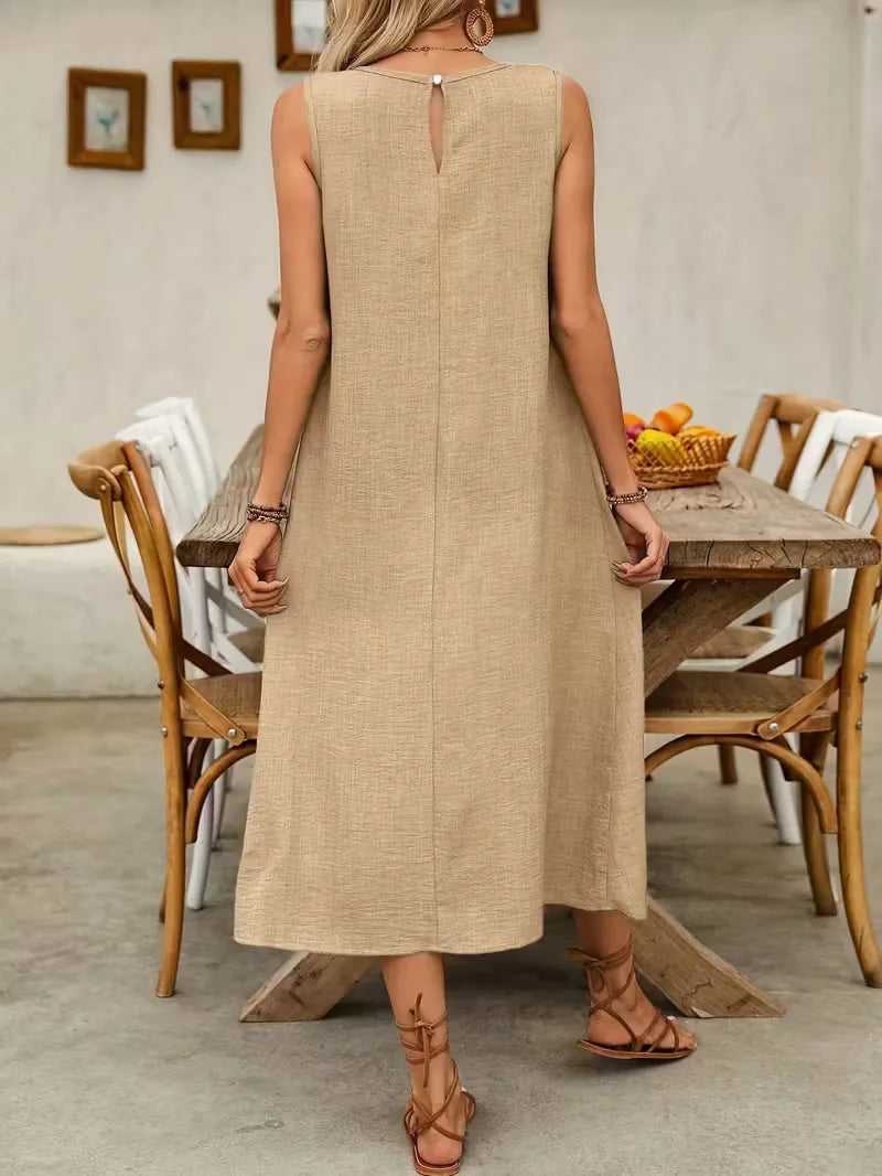 Stijlvolle khaki A-lijn jurk met zakken, een veelzijdige mouwloze midi voor zomerse casual outfits.