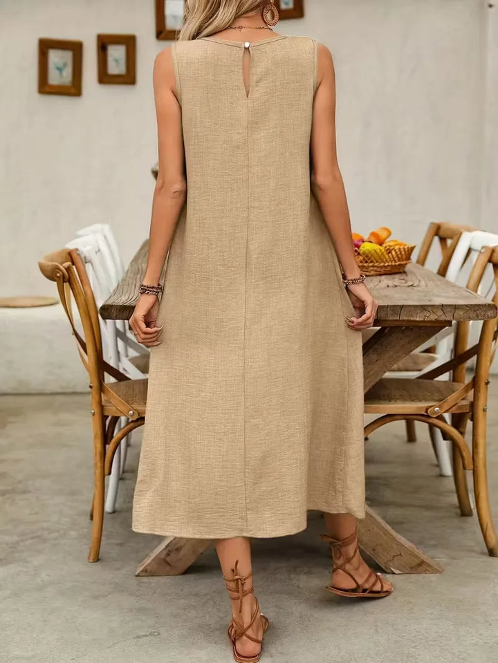 Stijlvolle khaki A-lijn jurk met zakken, een veelzijdige mouwloze midi voor zomerse casual outfits.