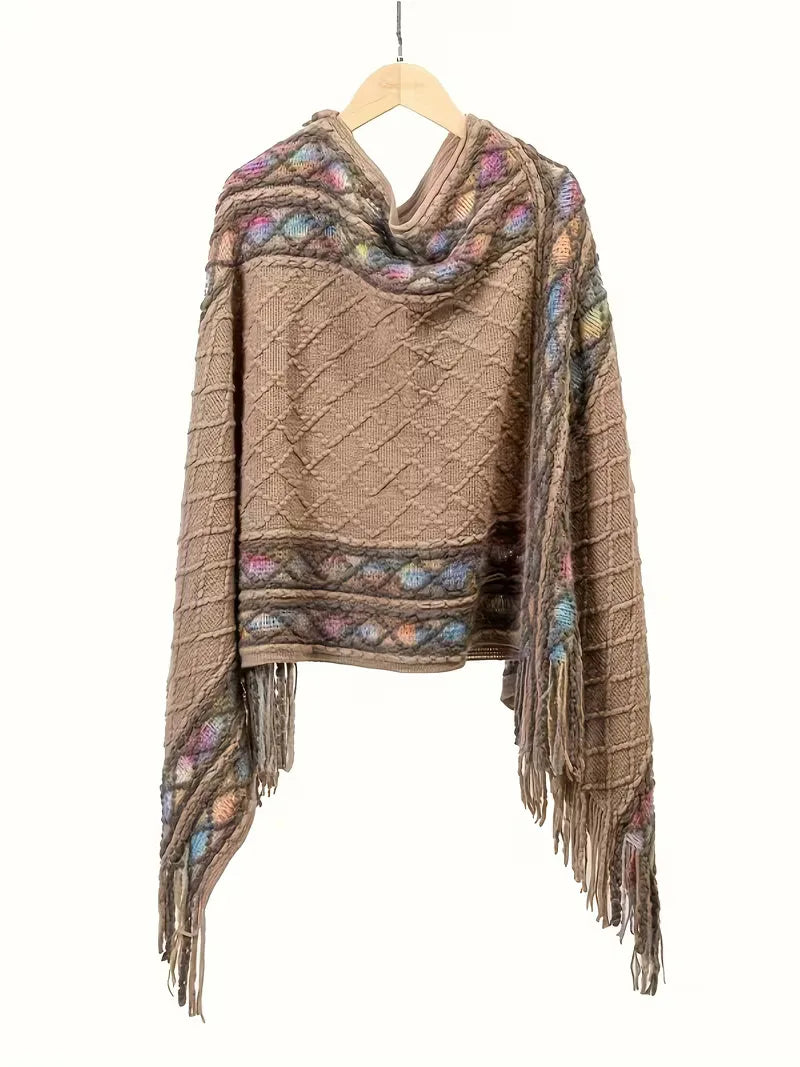 Comfortabele oversized gebreide trui voor dames met V-hals en bohemian franjes, ideaal voor winterdagen.