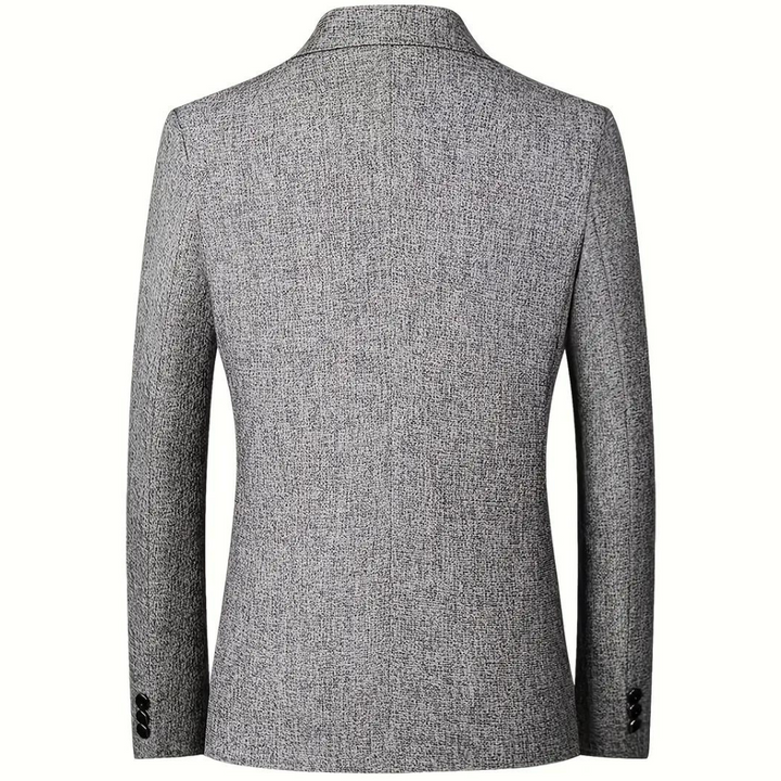 Grijze heren blazer met fijne textuur; een elegant colbert dat gemakkelijk te combineren is voor mannenmode.