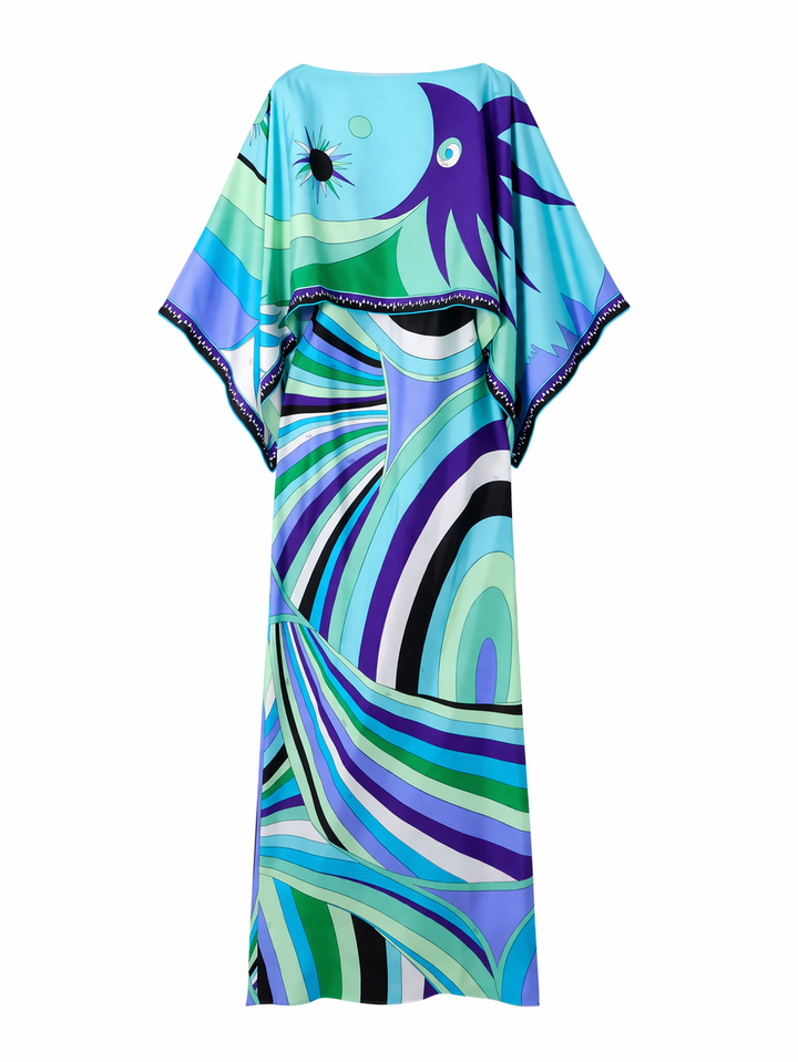Lange zomerse tweedelige damesjurk met geometrische print. Ideaal als elegante avondkleding of casual chic.