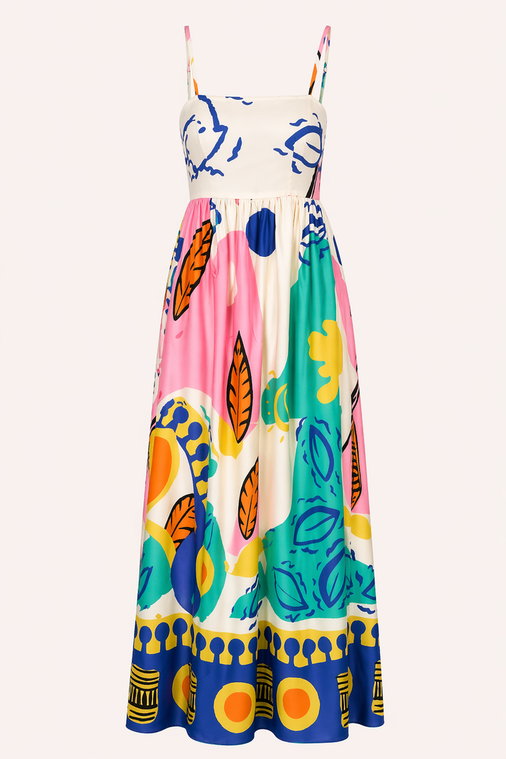 Dames lange zomerjurk met frisse grafische print en subtiele split, ideaal voor strand of vakantie.