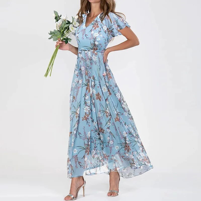 Lange zomerjurk met levendige bloemenprint, luchtig en stijlvol maxi-model, ideaal voor zonnige dagen en zomerse uitstapjes.
