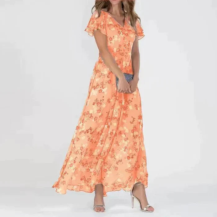 Lange zomerjurk met levendige bloemenprint, luchtig en stijlvol maxi-model, ideaal voor zonnige dagen en zomerse uitstapjes.