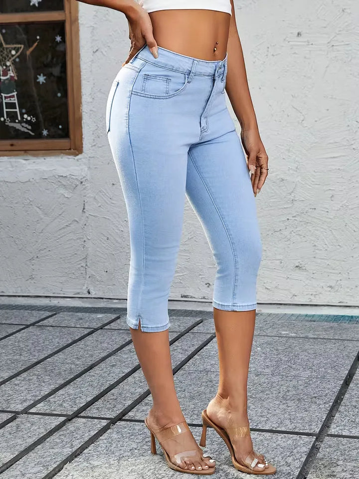 Trendy blauwe dames skinny jeans met moderne splitzoom, perfect voor casual looks.