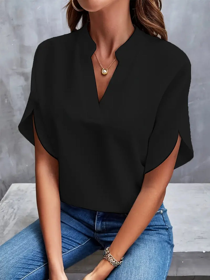 Lichtgewicht damesblouse met elegante afwerking, ademend ontwerp, perfect voor kantoor en casual gelegenheden.
