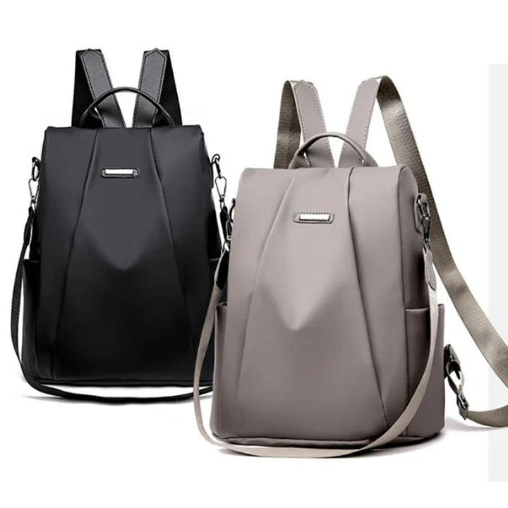 Comfortabele veelzijdige dames rugzak van waterafstotend nylon, te dragen als rugzak, schouder- of crossbodytas.