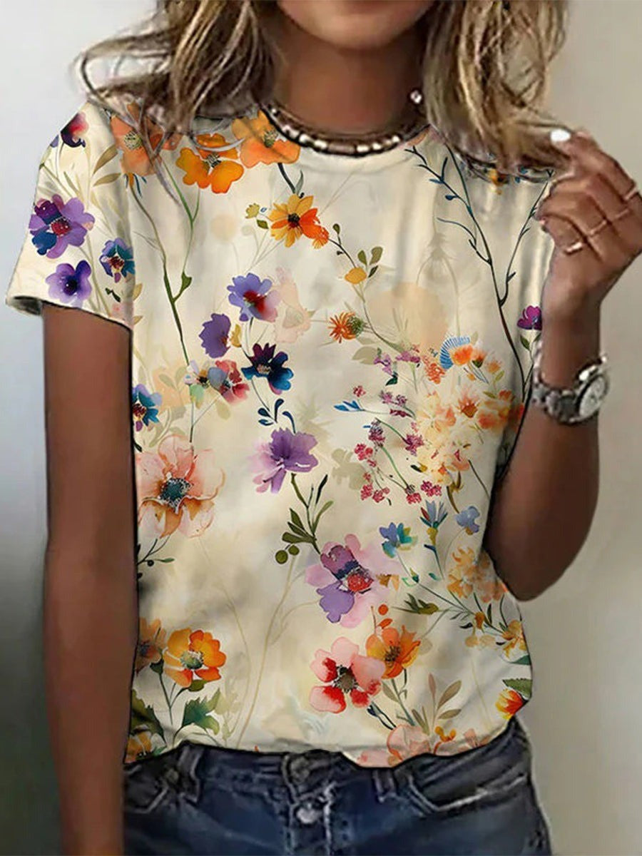 Luchtig dames T-shirt met levendige bloemenprint, ronde hals en korte mouwen, ideaal voor zomercomfort en casual looks.