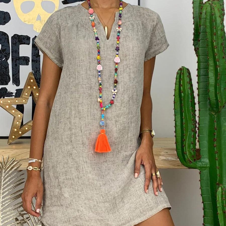 "Luchtige damesjurk van katoen en linnen, lichte zomerse stijl, ademend en comfortabel voor warme dagen."