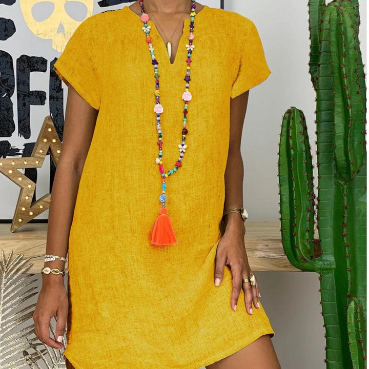 "Luchtige damesjurk van katoen en linnen, lichte zomerse stijl, ademend en comfortabel voor warme dagen."