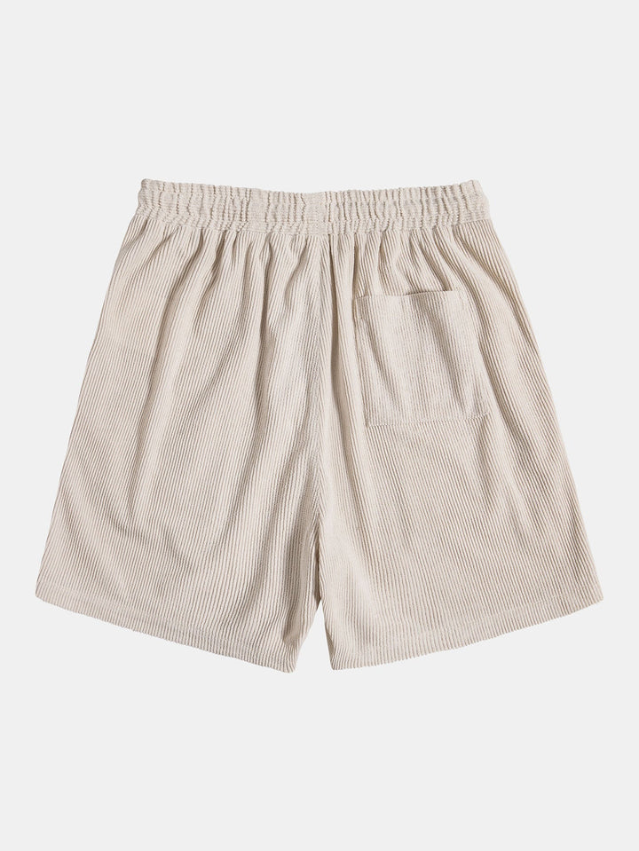 "Luchtige heren zomerset met comfortabel overhemd en korte broek, ideaal voor warme dagen en stijlvolle casual looks."