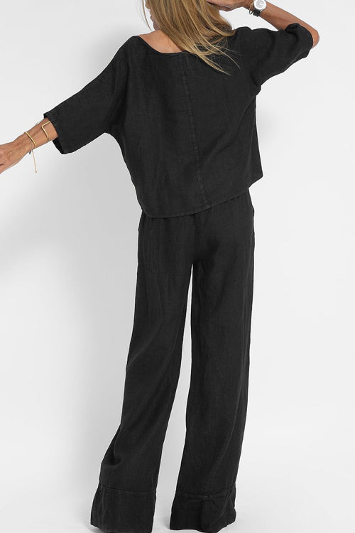 "Luchtige katoenen-linnen tweedelige set met wijde broek en cropped top, perfect voor zomerse elegantie en comfort."