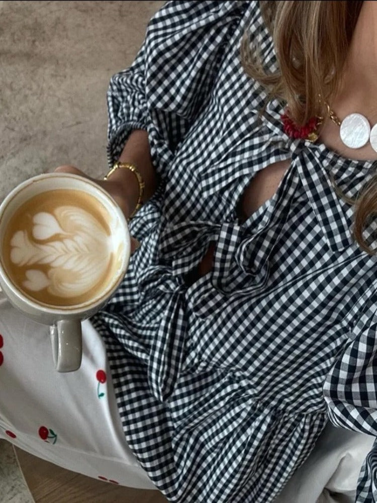 Luchtige Mila blouse voor dames met stijlvolle streepjes, pofmouwen en losse pasvorm ideaal voor lente en zomer.