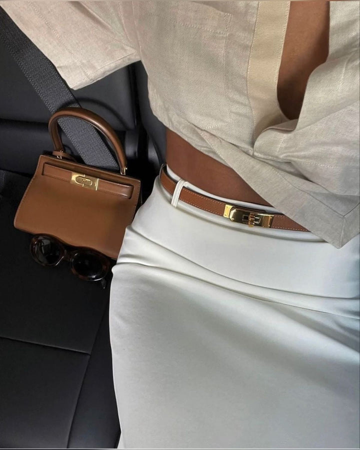 "Luxe damesriem van kunstleer, elegant design, verstelbare lengte, stijlvolle metalen gesp, zwart, bruin, taupe kleuren."