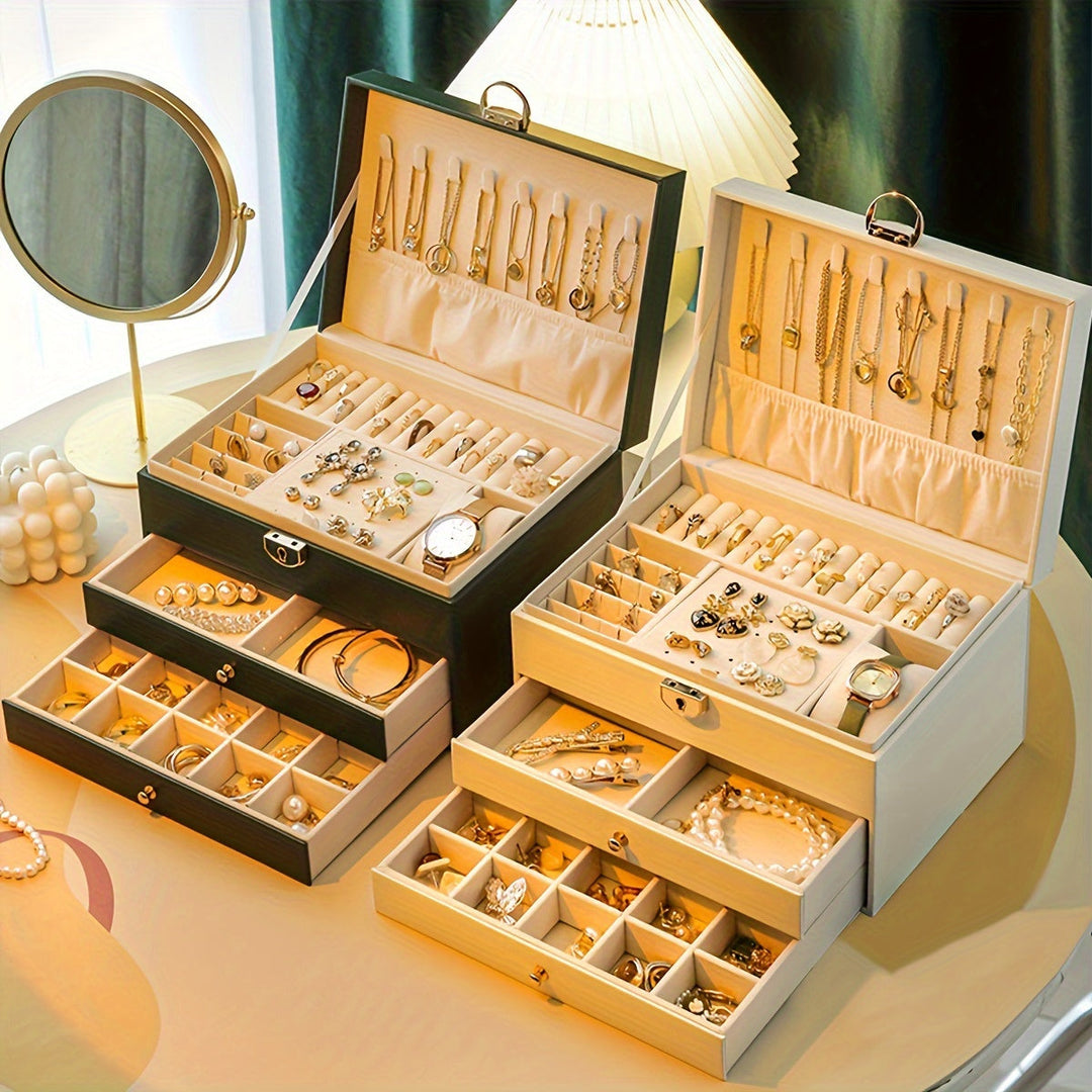 "Luxe sieradendoos van leer met meerdere vakken voor ringen, kettingen en armbanden, elegant en duurzaam design."