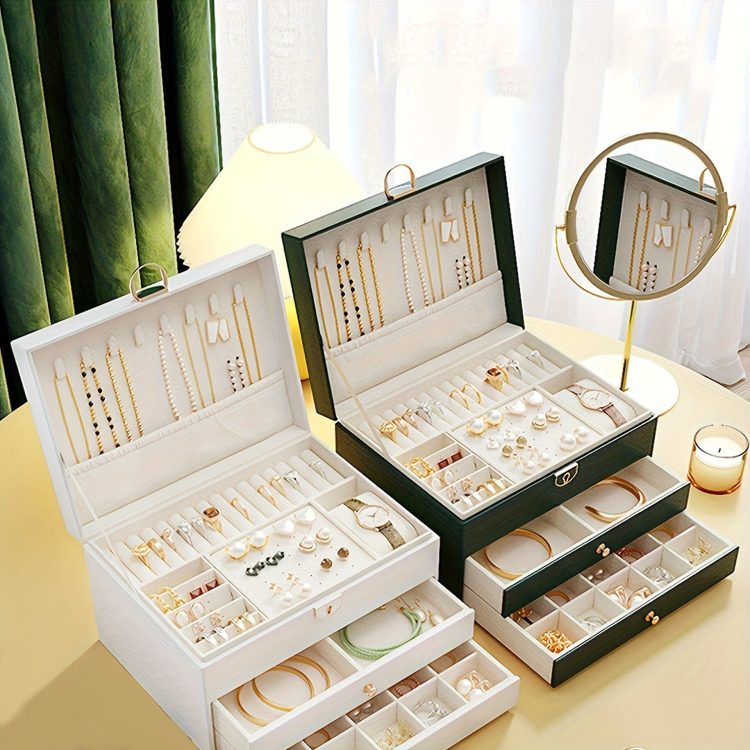 "Luxe sieradendoos van leer met meerdere vakken voor ringen, kettingen en armbanden, elegant en duurzaam design."