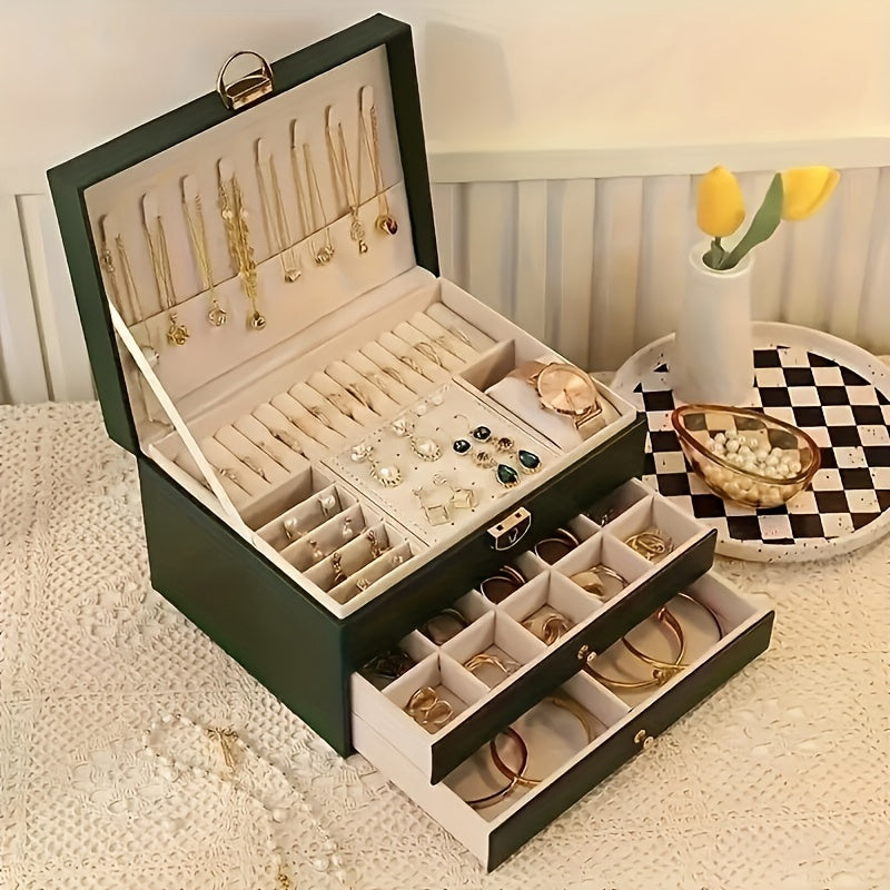 "Luxe sieradendoos van leer met meerdere vakken voor ringen, kettingen en armbanden, elegant en duurzaam design."