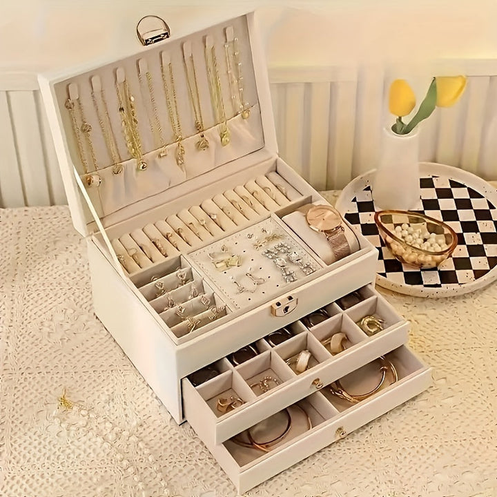 "Luxe sieradendoos van leer met meerdere vakken voor ringen, kettingen en armbanden, elegant en duurzaam design."