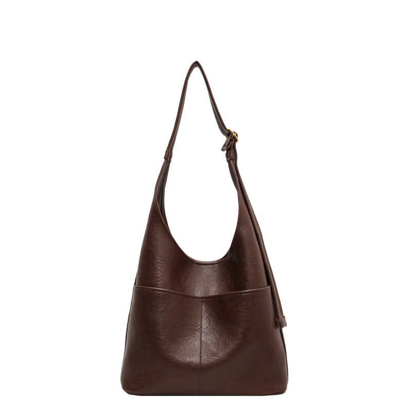 "Luxe vrouwen leren tas, grote voorzijde, elegant design, hoogwaardig zwart leer, ruime tas voor dagelijks gebruik."