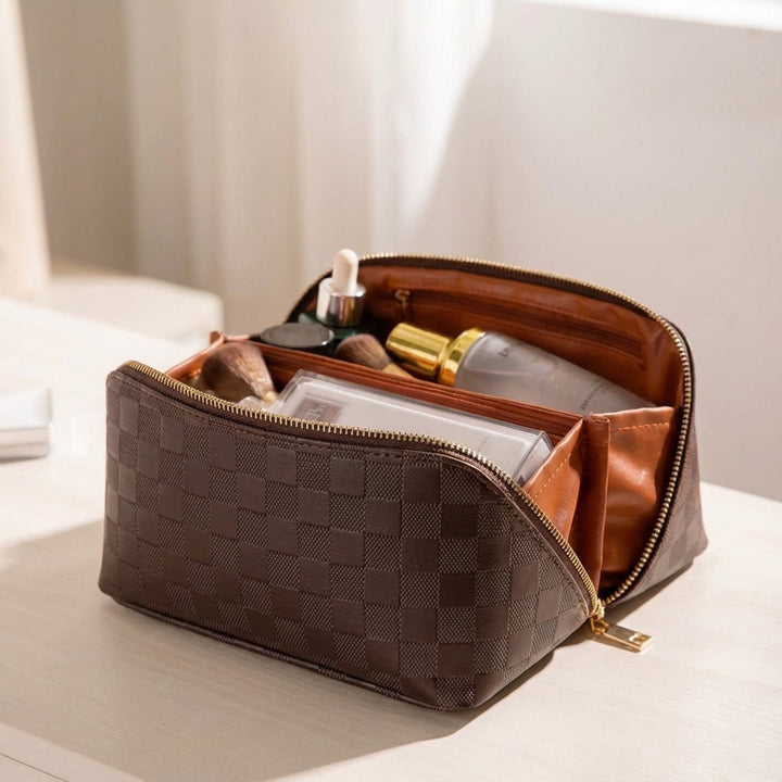 Zwarte luxe make-up toilettas, compact en toch ruim, waterafstotend PU leer, perfecte cosmetica organizer.