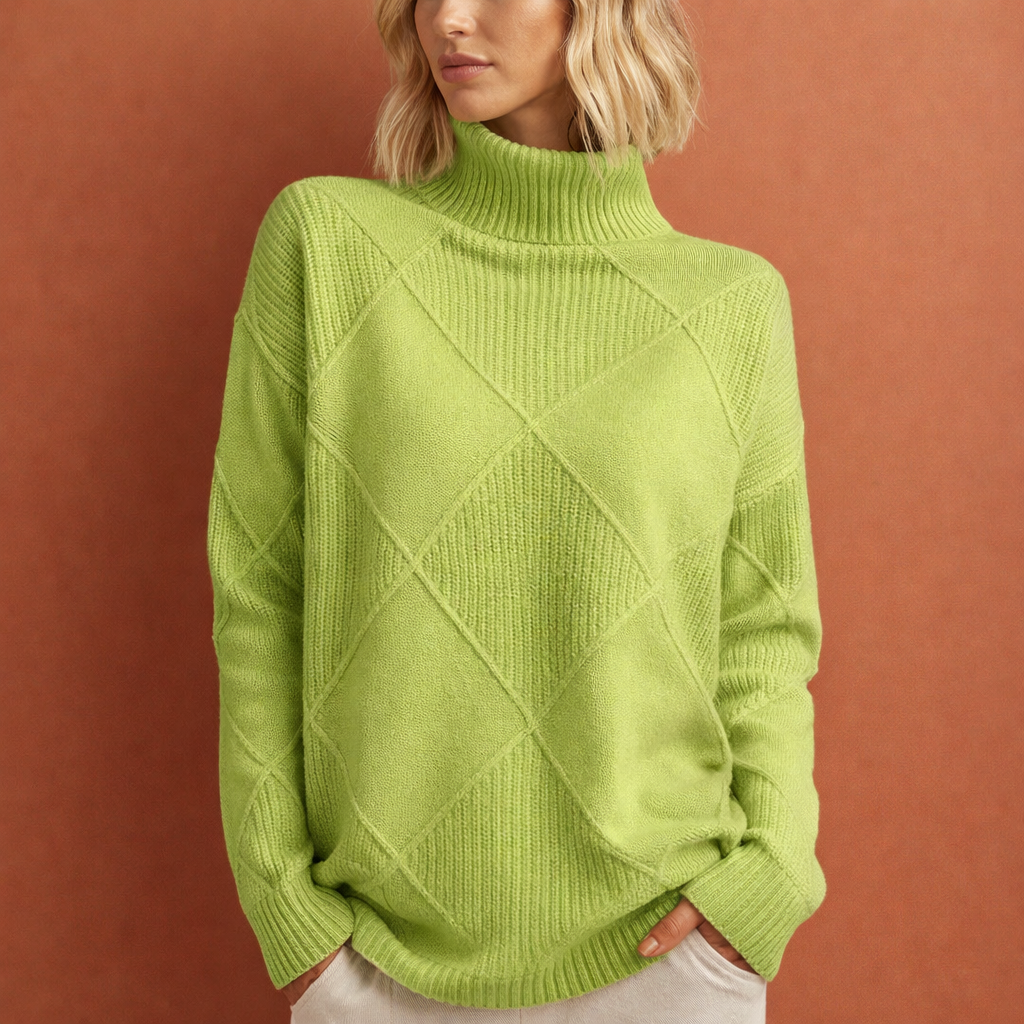 Model draagt een comfortabele gebreide dames wintertrui in een effen kleur, perfect voor koude dagen.