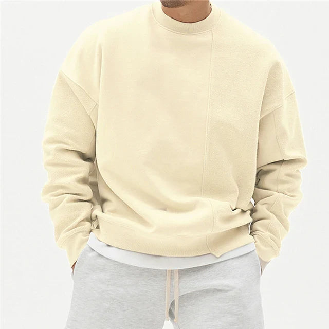 Comfortabele oversized heren sweater met trendy asymmetrische naad en ronde hals, perfect voor relaxte winterdagen.