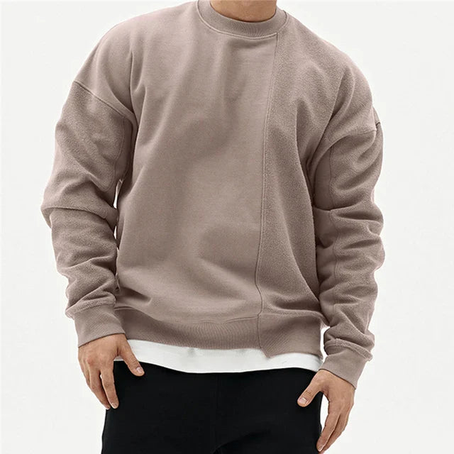 Trendy heren winter sweater met unieke asymmetrische naad en ronde hals; comfortabel, oversized en stijlvol.