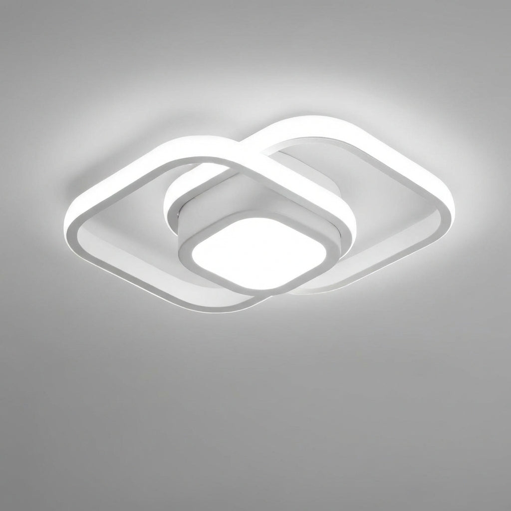 Horizontale weergave van moderne LED plafondlamp, wit en minimalistisch met dubbele ringen, sfeervol interieur