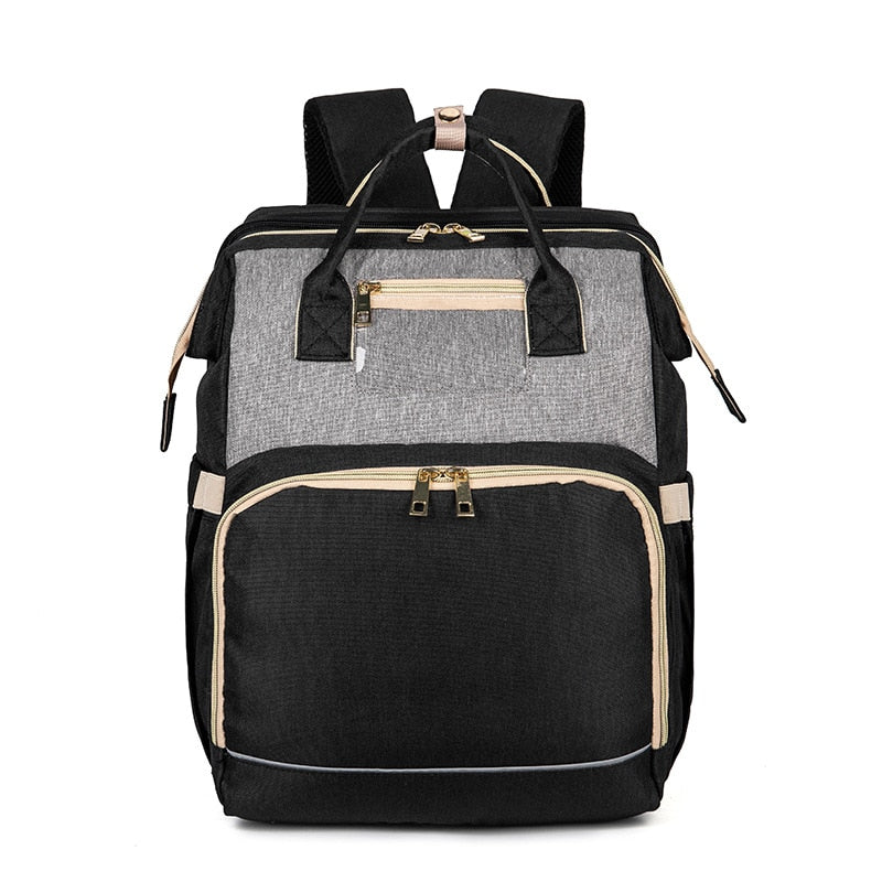 Moderne babyrugzak met multivakken; transformeerbaar tot comfortabel babybedje voor onderweg.