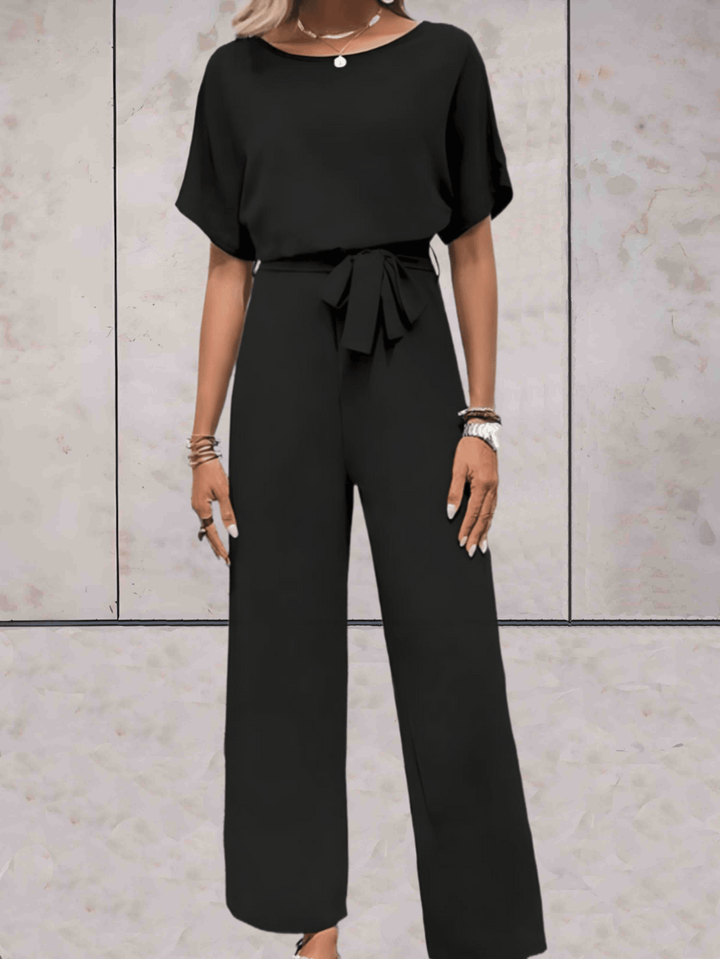 "Noa jumpsuit dames in stijlvol design, luchtige stof, elegante uitstraling met wijde mouwen en speelse details."