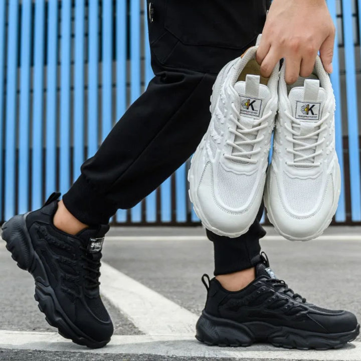 "Onverwoestbare zwarte werksneakers met stalen neus, anti-plet, flexibele zool, ideaal voor bescherming en comfort."