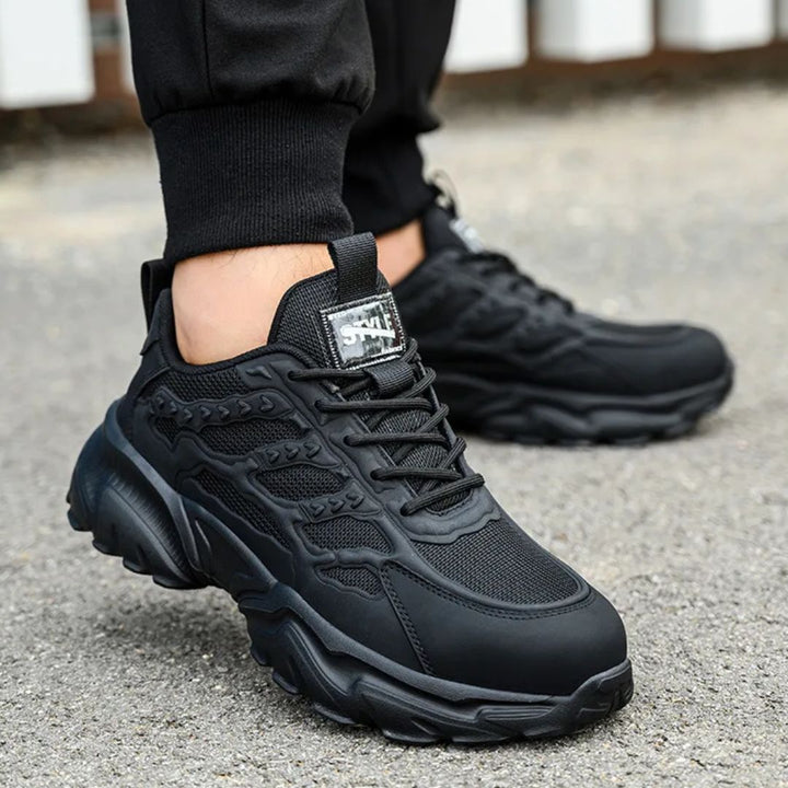 "Onverwoestbare zwarte werksneakers met stalen neus, anti-plet, flexibele zool, ideaal voor bescherming en comfort."